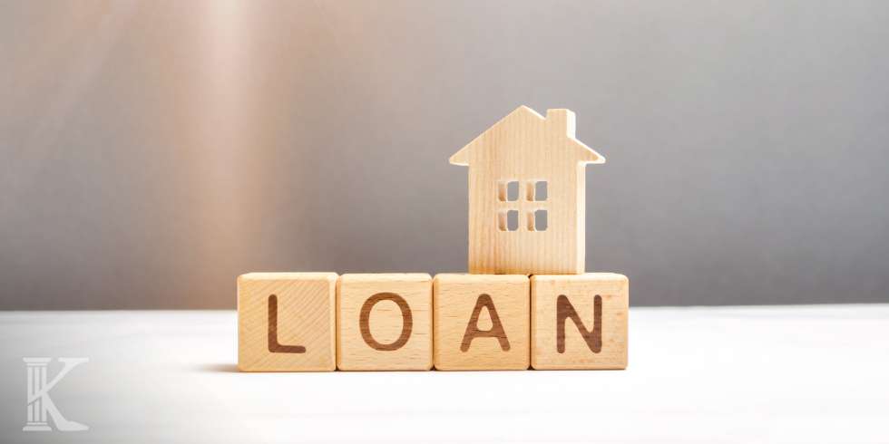 Drewniane klocki z napisem LOAN - pożyczka